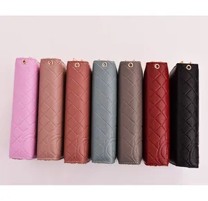 Selection of colorful quilted leather long wallets showing side profile and textures