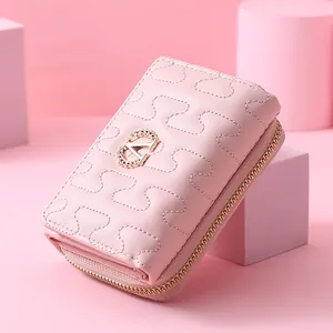 Elegant pink quilted short wallet for women featuring a wheat-ear 'A' metal logo.