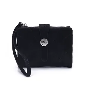 Minimalist black textured short wallet for women featuring a silver butterfly clasp and wristlet