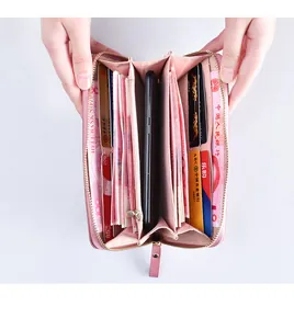 Interior view of pink double zipper long wallet showing large capacity for phone and cards