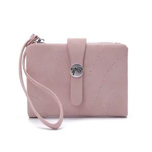Elegant pink short wallet for women featuring a stylish bowknot buckle and wristlet strap