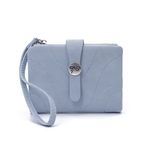 Light blue short wallet for women with wristlet strap and bow buckle detail