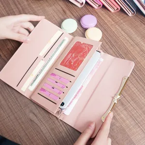 Pink long leather trifold wallet for women with multiple card slots and phone pocket