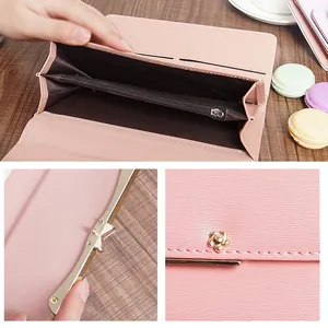 Elegant pink long wallet for women featuring a floral clasp and multiple card slots
