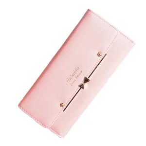 Elegant pink long wallet for women featuring a gold bow ornament and cute rivet details