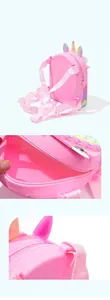 Detailed view of pink unicorn silicone backpack for kids with pop-it fidget toy design