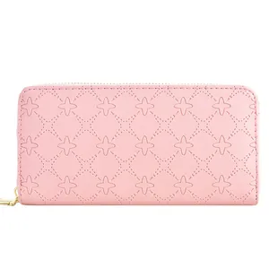Elegant pink long wallet for women with embossed star pattern and zipper closure