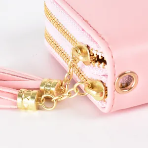 Elegant pink women's long clutch bag featuring double zippers and decorative tassels