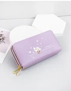 Detailed view of a purple long leather wallet featuring a heart charm and bird print design