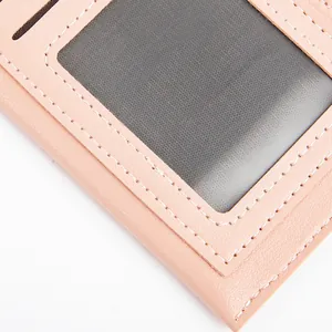 Pink PU leather card holder wallet detail featuring a transparent mesh ID window.