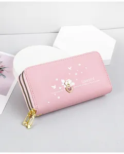 Detailed view of pink long wallet featuring heart prints and Lovebird English text