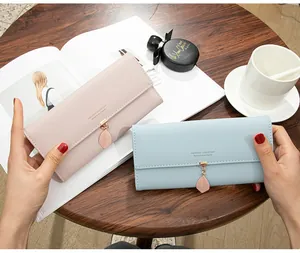 Elegant women's long tri-fold wallet featuring a delicate leaf pendant in pink and blue