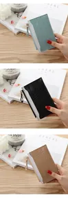 Three crocodile pattern slim card holder wallets shown in blue, black, and beige colors