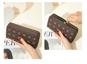 Close-up of double-zipper women's long wallet with elegant golden floral prints