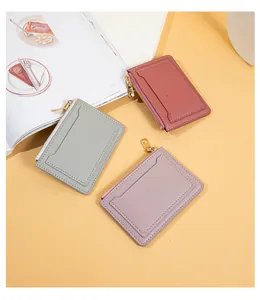 Detail view of colorful faux leather zipper card holders and coin purses