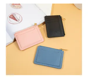 Slim minimalist zipper card holder and coin purse for women in pink, black, and blue colors
