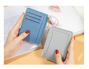 Close-up detail showing blue and grey zippered card holders with multi-slot design