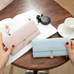Elegant long tri-fold women's wallet with leaf pendant charm in pink and light blue