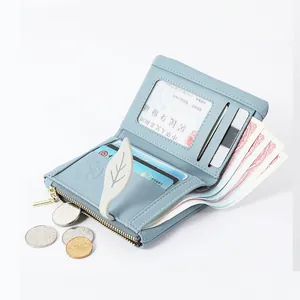 Small blue soft leather bi-fold wallet for women with card slots and coin pocket