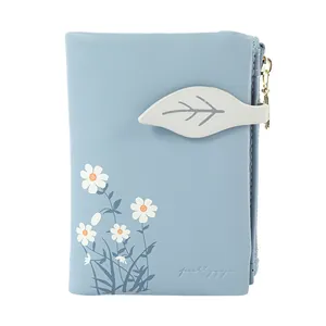 Elegant light blue bifold wallet for women featuring cute daisy floral prints and leaf strap