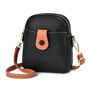 Petit sac à bandoulière élégant en cuir grainé noir et marron pour téléphone