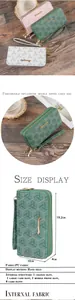 Elegant women's long double zipper wallet featuring geometric Y-print and wrist strap detail