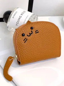 Cute brown cat-shaped card holder in pebbled leather with unique cat tail zipper pull