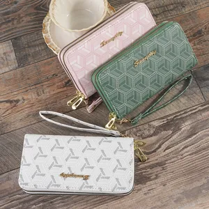 Stylish women's long wallets featuring geometric cube prints and double gold zippers