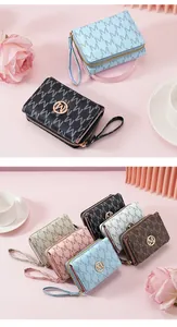 Detailed view of fashionable women's tri-fold wallets with 'M' print in various colors