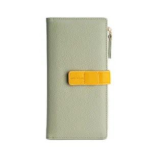 Stylish light green long women's wallet featuring contrast yellow strap and gold zipper