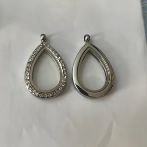Detailed view of teardrop floating lockets in plain silver and rhinestone designs