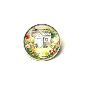 Detailed view of vintage cottage garden brooch with colorful floral painting design