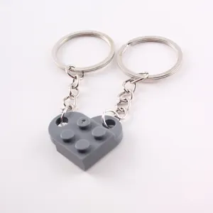 Detailed view of the interlocking gray heart-shaped building block brick keychain set