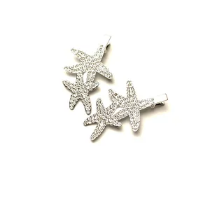 Elegant silver starfish hair clips with sparkling crystals, duckbill style for women