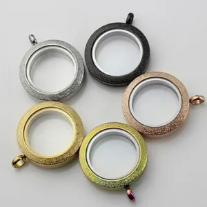 Detail shot of round stainless steel glass lockets in five different glitter finishes.