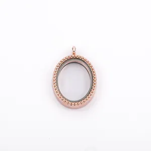 Elegant rose gold oval floating locket pendant with beaded edge and clear glass frame