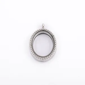 Detailed view of an oval silver floating locket with beaded border design