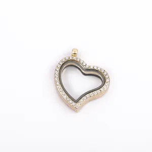 Detail view of a gold heart-shaped floating locket pendant with crystal pavé edging