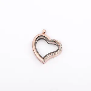 Close-up of heart-shaped floating locket pendant with crystals in rose gold finish