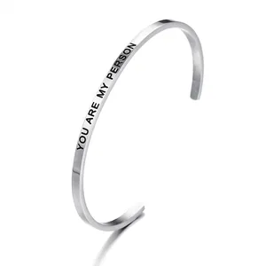 Detailed view of stainless steel cuff bracelet with 'YOU ARE MY PERSON' engraving