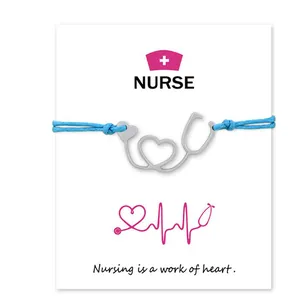 Detail view of nurse card bracelet featuring a silver stethoscope heart pendant design