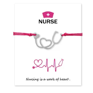 Pink wax cord nurse bracelet with stethoscope heart pendant on a gift message card