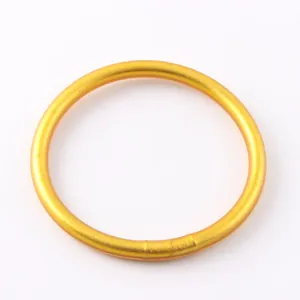 Close-up of a matte gold silicone bracelet showing smooth texture and uniform color