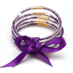 Elegante set di 5 braccialetti in silicone viola con fiocco in nastro di raso per donna