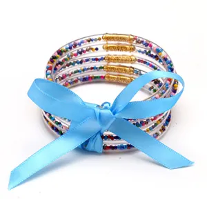 Set di 5 bracciali in silicone con perline colorate e fiocco di nastro blu brillante