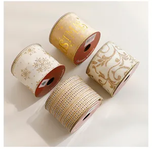 Collection of four decorative Christmas ribbon rolls with gold-stamped festive patterns