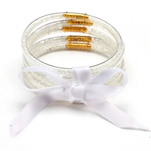 Set of 5 white silicone jelly bracelets with rice beads and elegant white ribbon bow