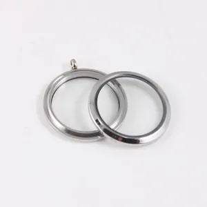 Detailed close-up of threaded stainless steel and glass floating charm locket pendant