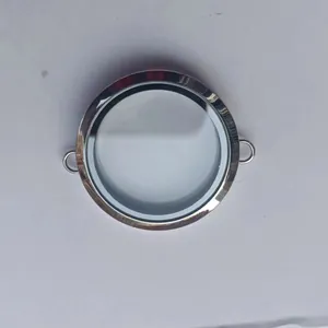 Close-up of a circular transparent silver locket pendant for DIY jewelry making
