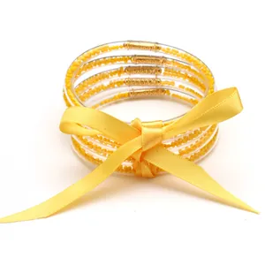Handmade 5-layer yellow silicone seed bead jelly bracelet set with satin ribbon bow
